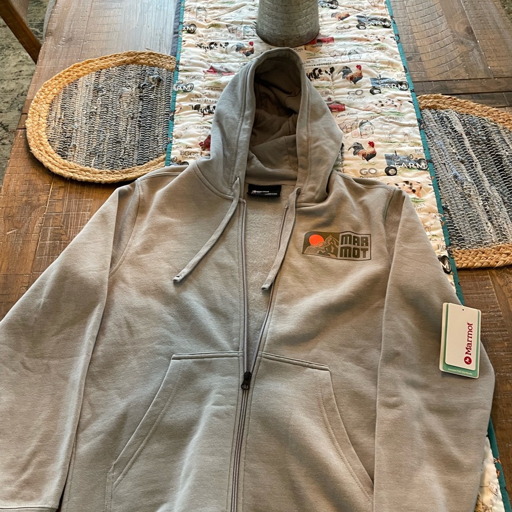 Brand new Marmot with tags and never been worn full length zip up hoodie.
